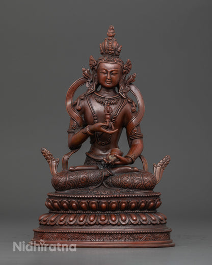 Vajrasattva seated on a double lotus pedestal holding vajra and bell