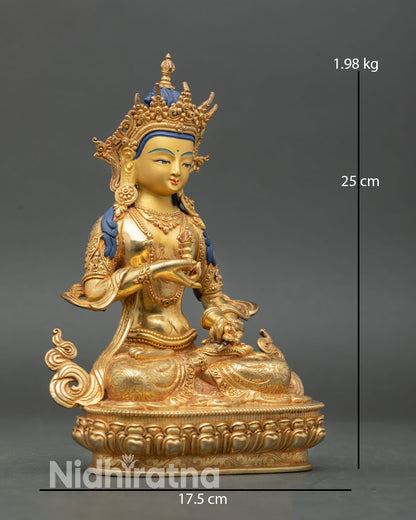 Vajrasattva side view meditative posture lotus seat vajra and bell, spiritual transformation, copper sculpture
