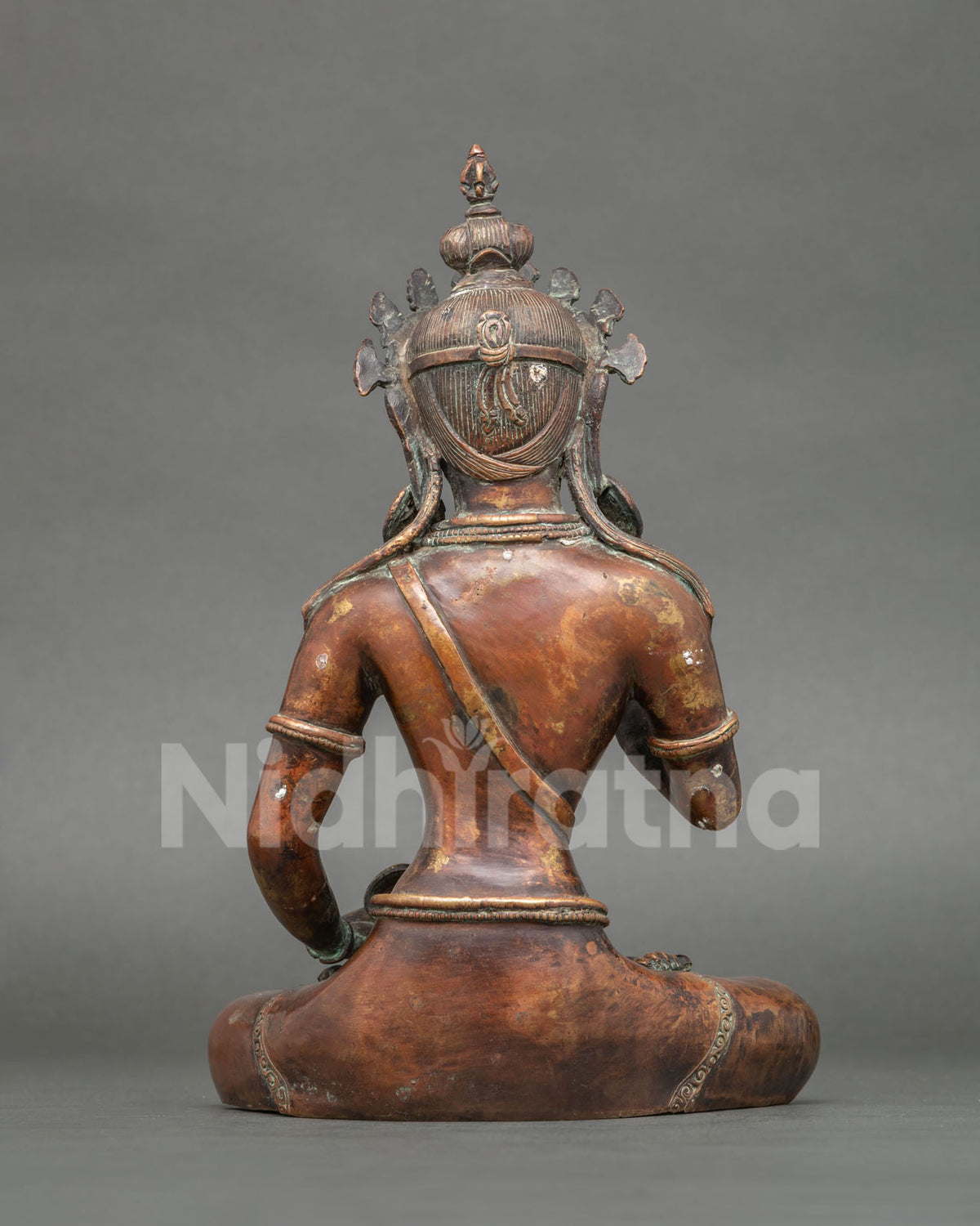 Vajrasattva statue back view chemically oxidized copper Newari craftsmanship.