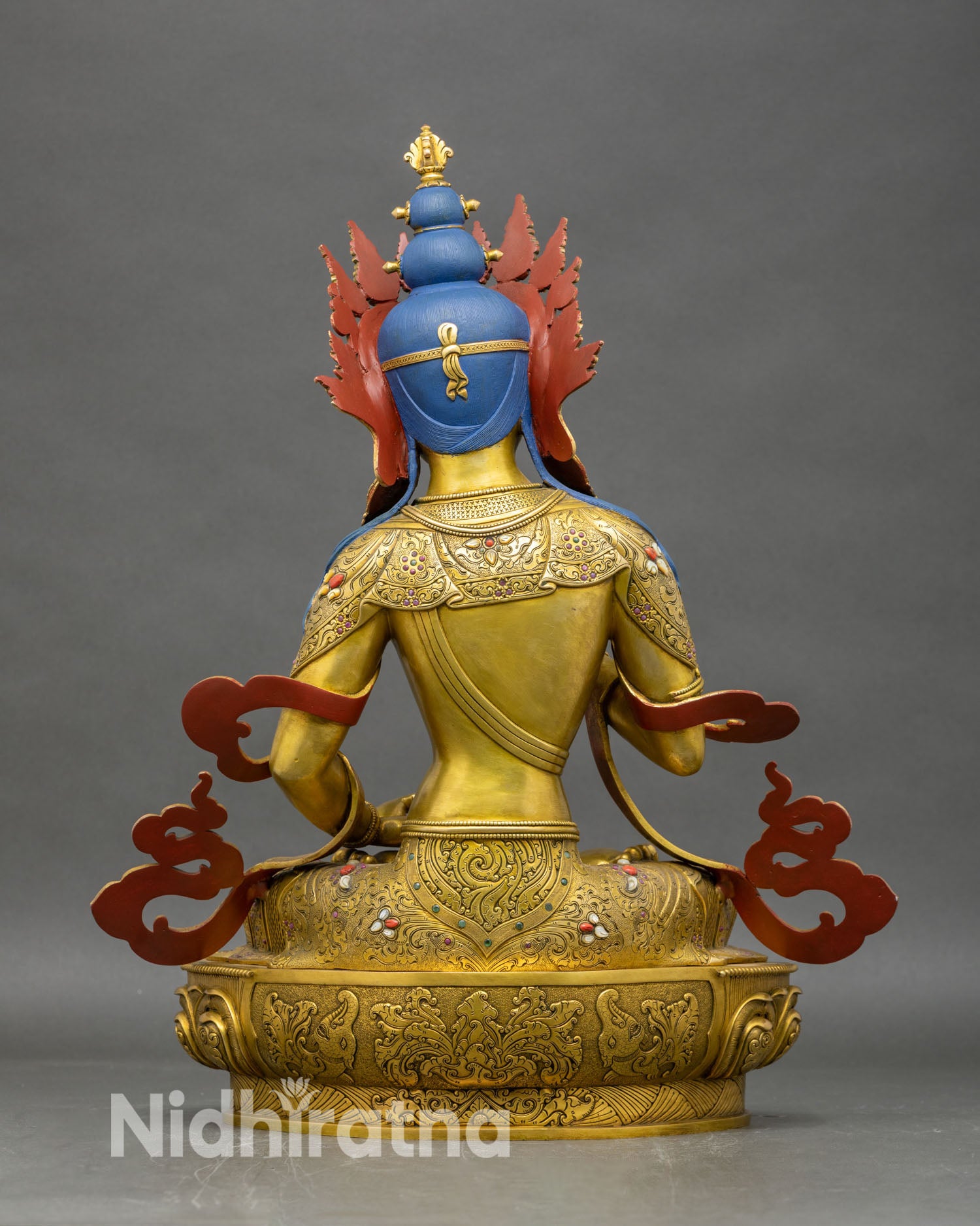 Back view of Vajrasattva statue showing detailed robe patterns and lotus throne craftsmanship