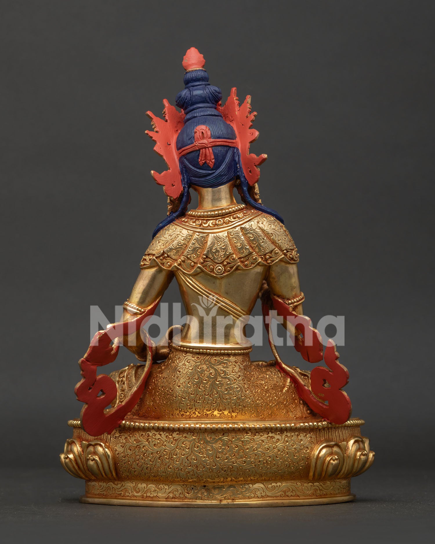 Vajrasattva statue back view showing hand carved floral motif garment and Nepalese artistry.