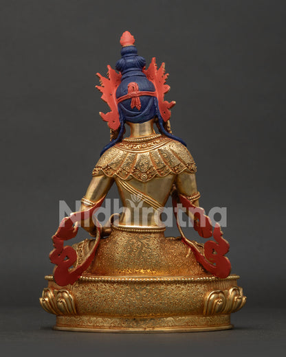 Vajrasattva statue back view showing hand carved floral motif garment and Nepalese artistry.