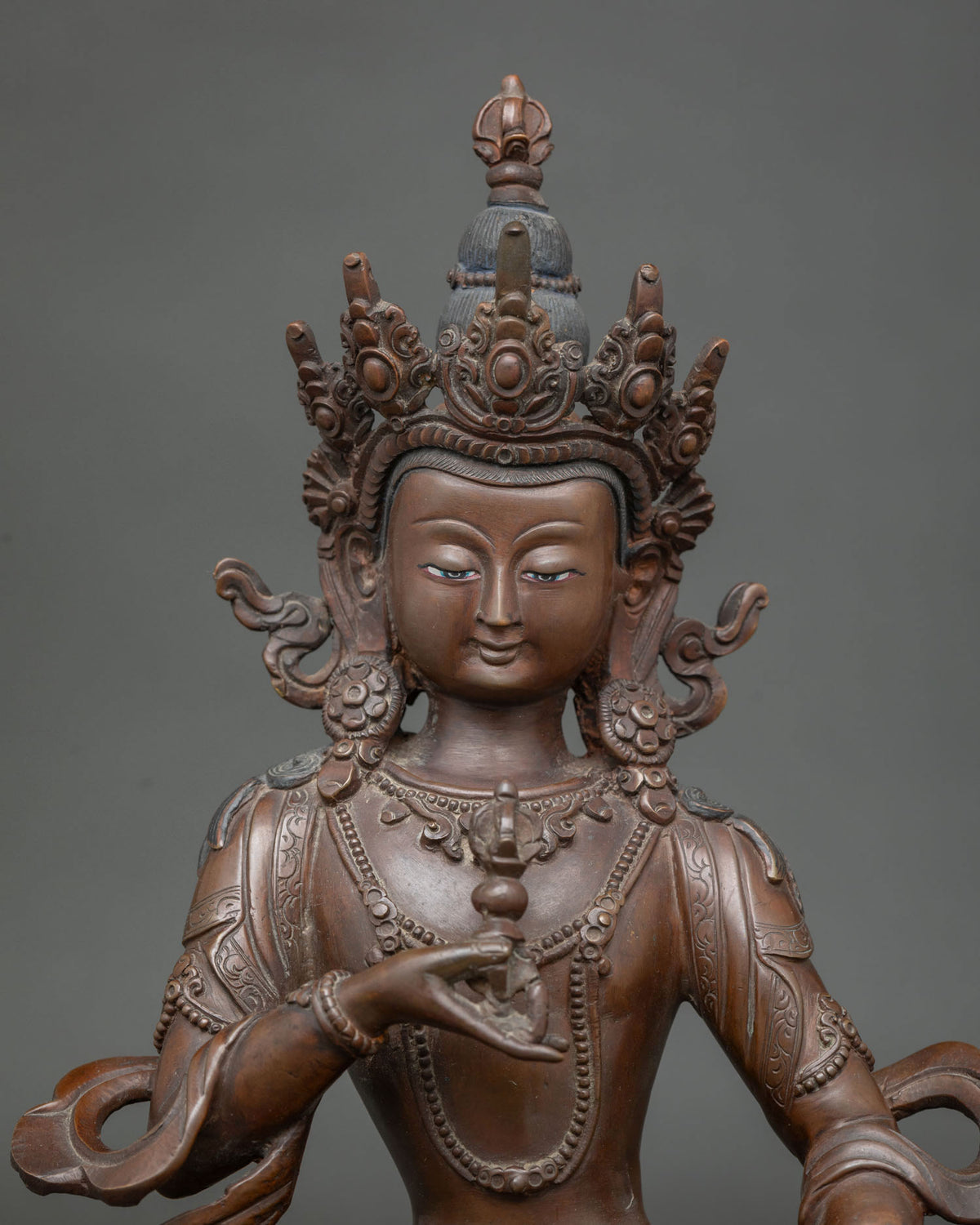 Vajrasattva Statue close up serene face and five pointed crown details