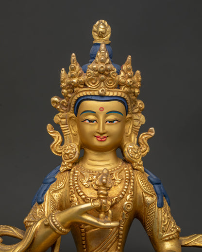 Vajrasattva Statue close up showing gold painted face five jewel crown and vajra