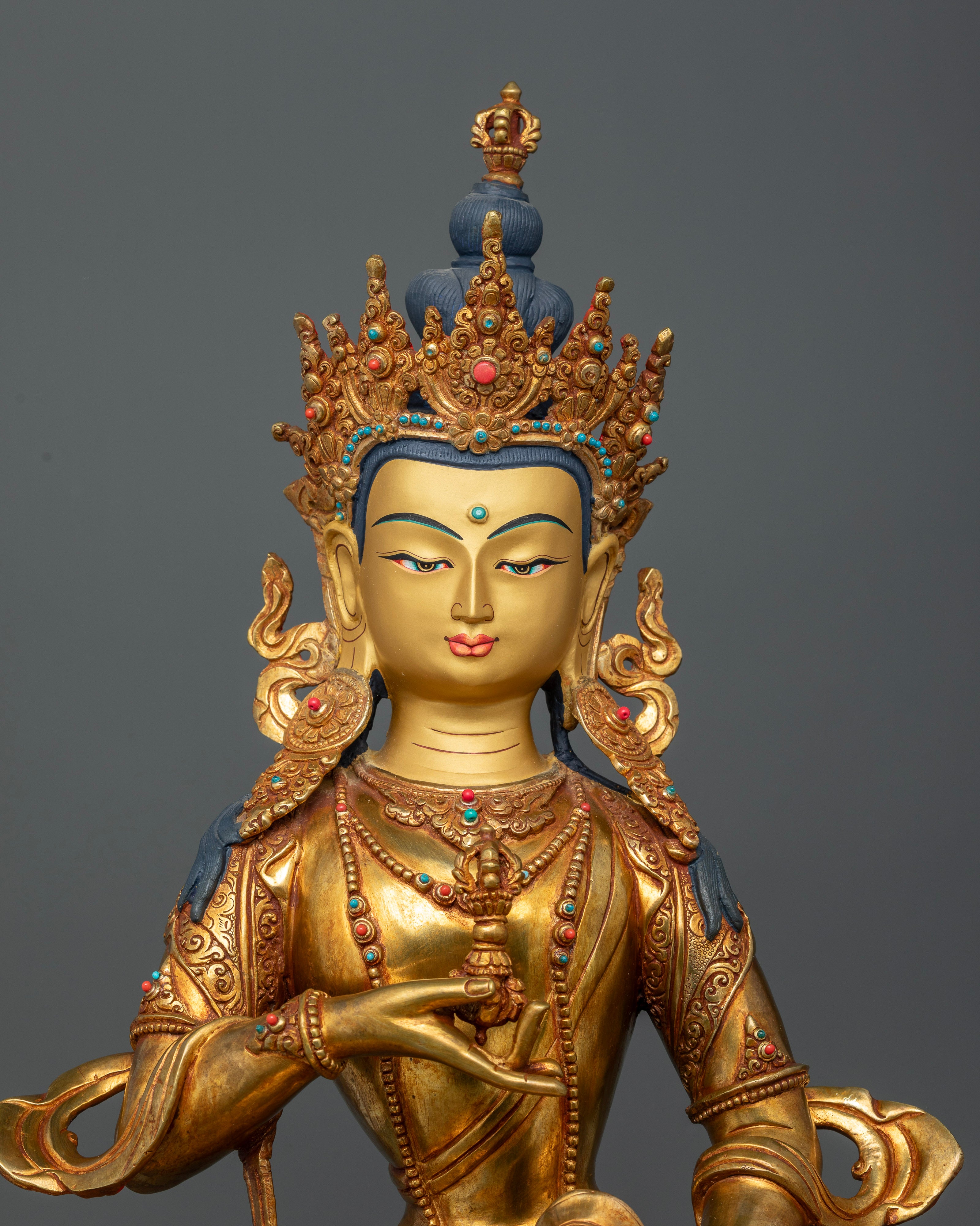 Vajrasattva Statue close up view highlighting vajra bell and intricate floral carvings