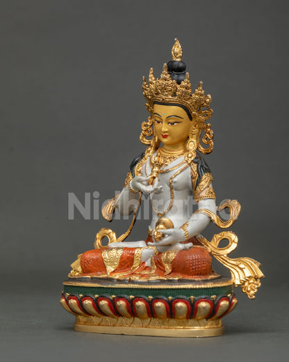 Vajrasattva statue delicately engraved robes lotus pedestal.
