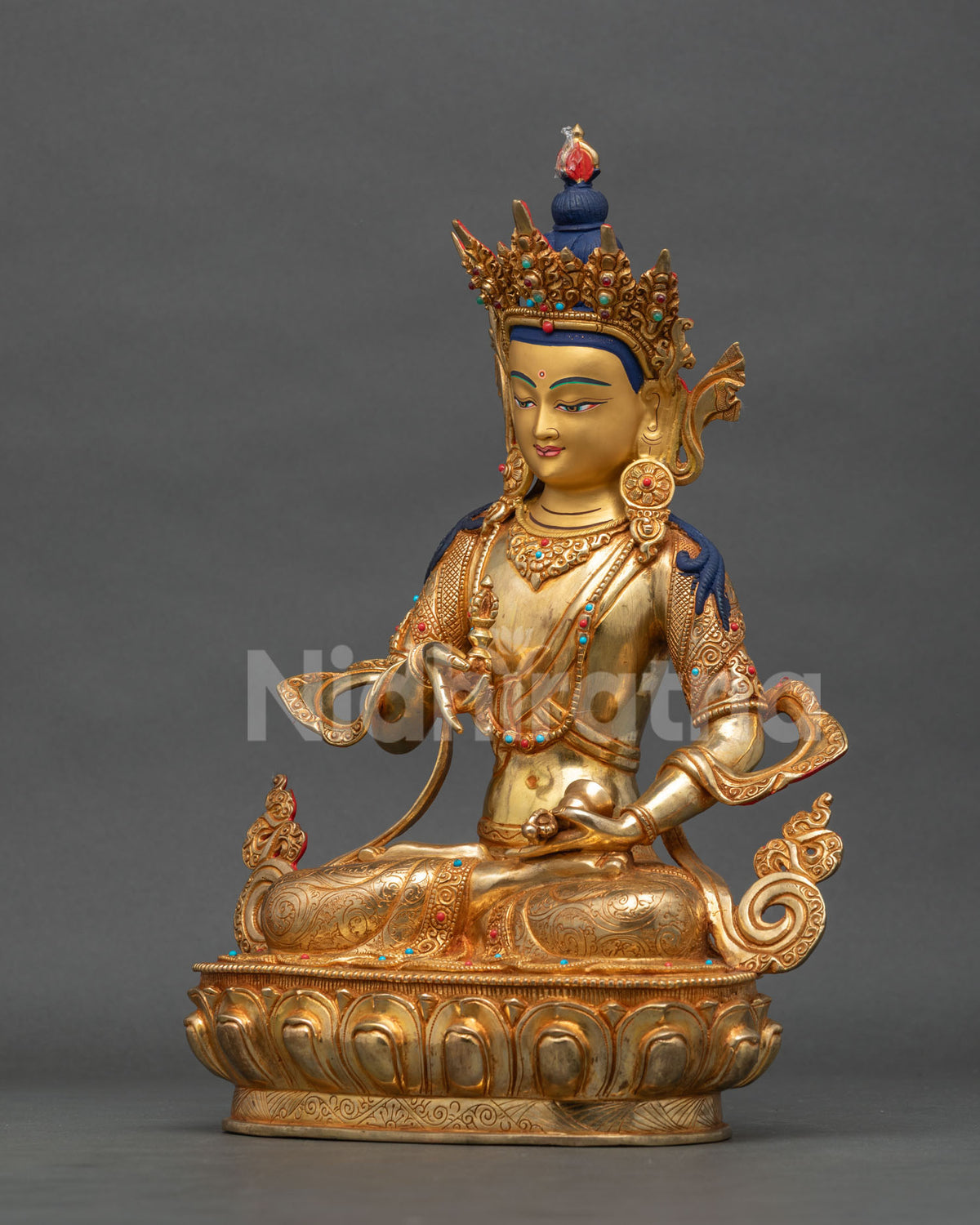 Vajrasattva statue detailed silk garment gold fire gilded finish.