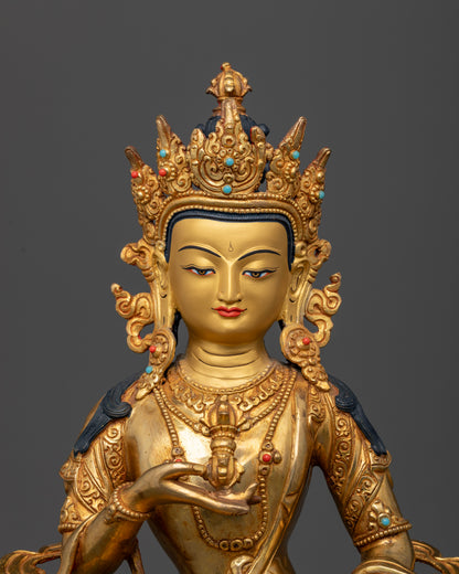 Vajrasattva Statue face close up 24K gold painted face ornate crown.