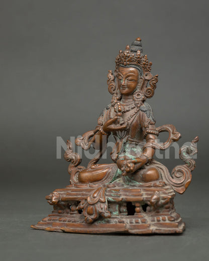 Vajrasattva statue finely chased ornaments and layered necklaces detail view.