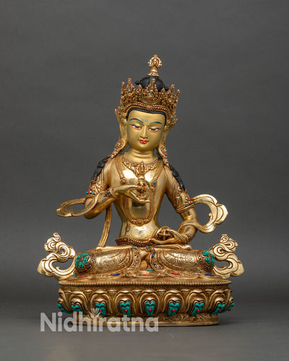 Vajrasattva statue front view, gold fire-gilded copper with vajra and bell