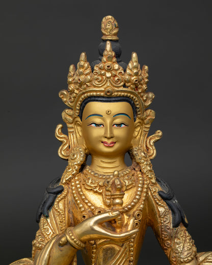 Vajrasattva Statue gold painted face and intricate floral motif silk garment detail.