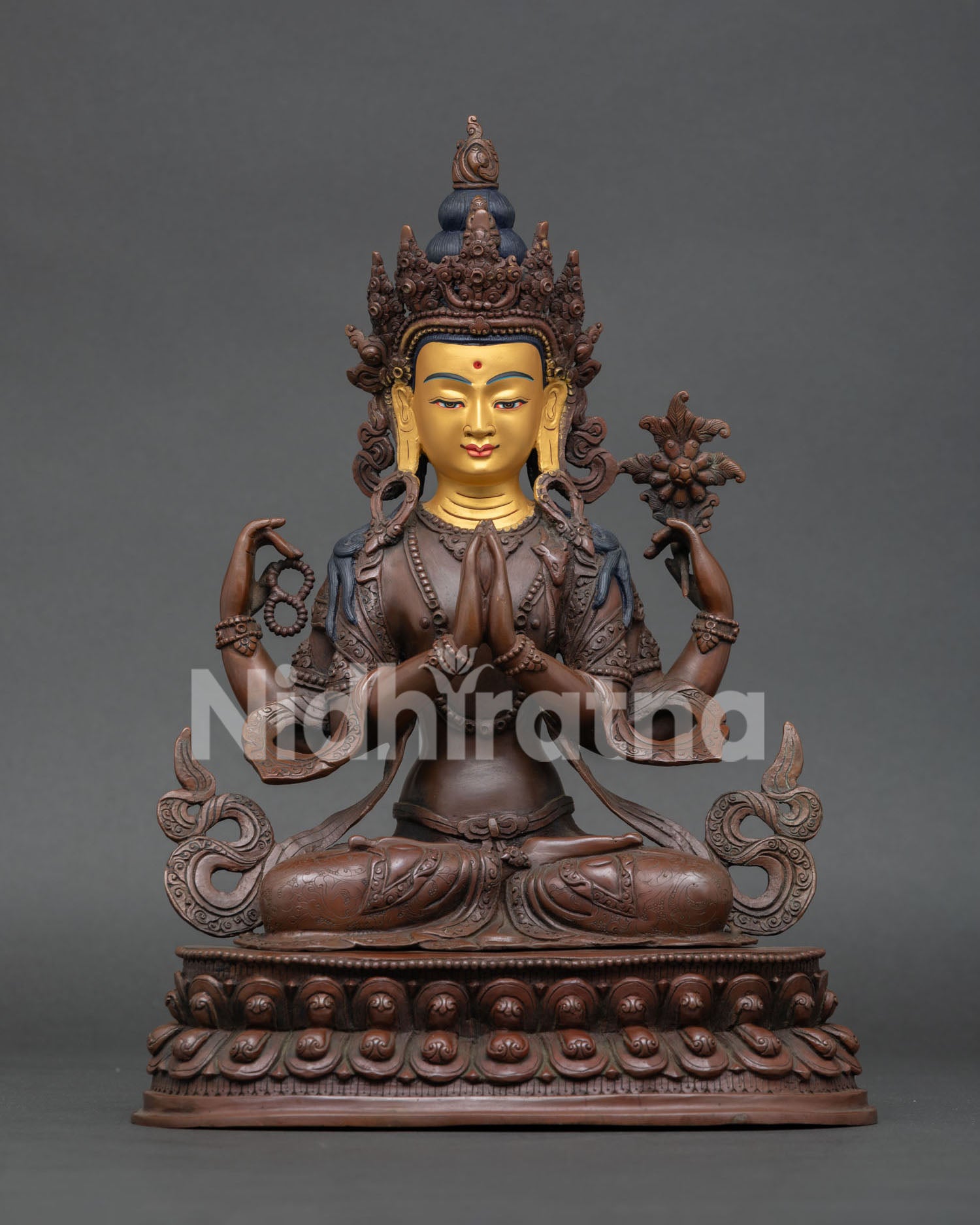 Vajrasattva statue handcrafted in Nepal with oxidized copper finish and gold painted face.