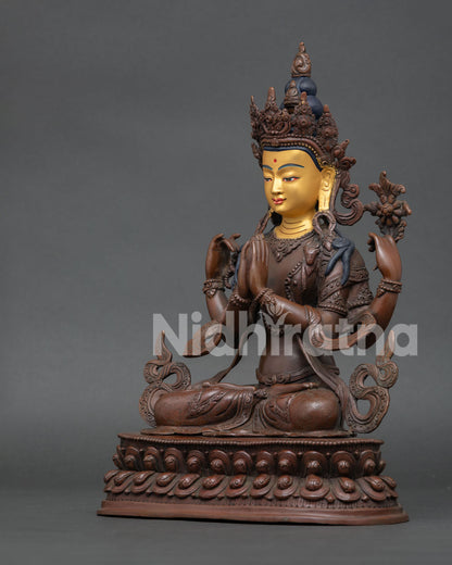 Vajrasattva statue seated on double lotus throne holding jewel, crystal mala, and white lotus flower.