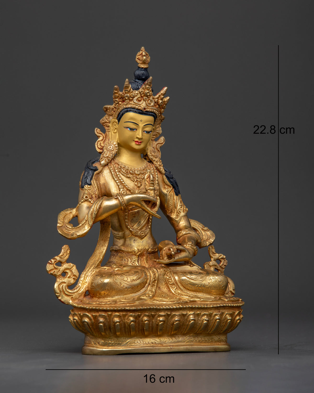 Vajrasattva statue seated on handcarved lotus pedestal with floral details.