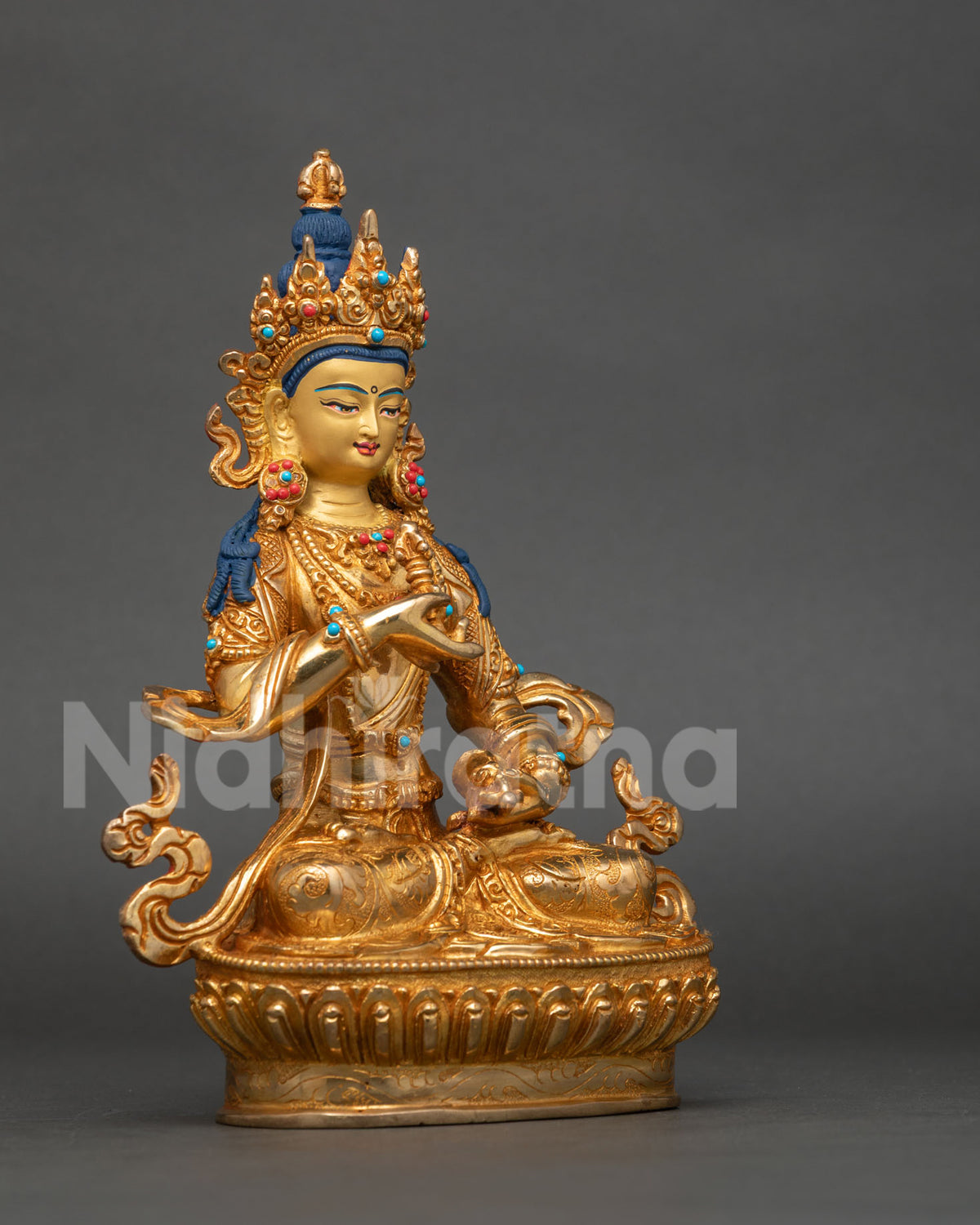Vajrasattva Statue seated on lotus pedestal with ornate jewelry