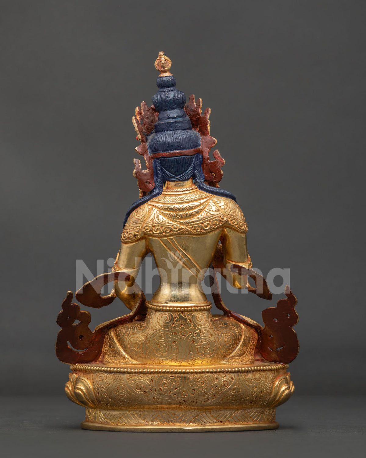 Vajrasattva statue with gold gilded copper celestial scarf floral motifs and traditional ornamentation.