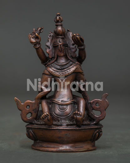 Vajrasattva with consort Buddhist statue on lotus pedestal for meditation altar.