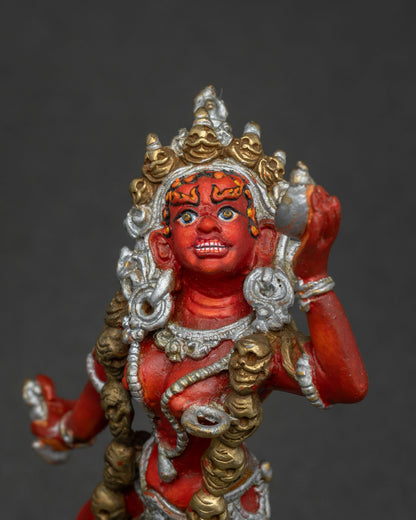Vajrayana dakini Vajrayogini statue with five skull crown and bone ornaments.