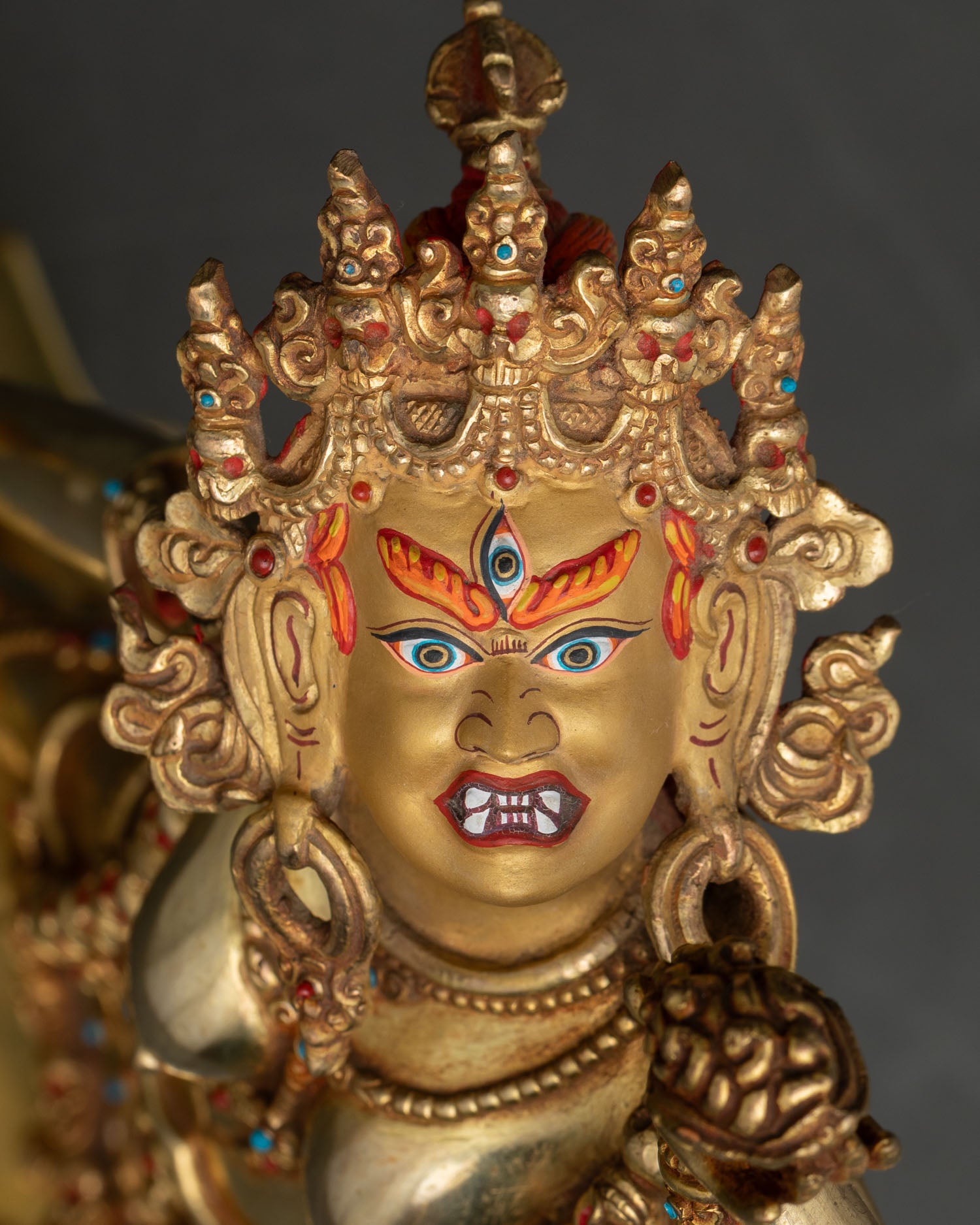 vajrayogini face close up gold gilded dakini statue serene expression