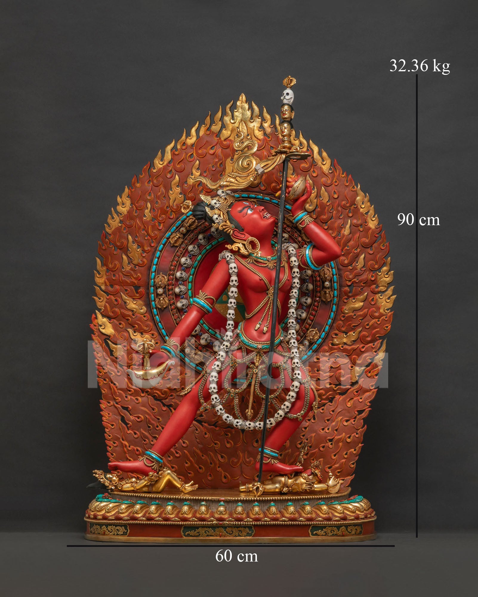 Vajrayogini statue front view, dancing dakini with flame halo and kapala