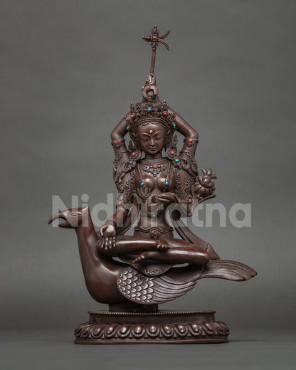 Varada Tara statue, boon-granting deity on a mythical mount, oxidized copper from Nepal