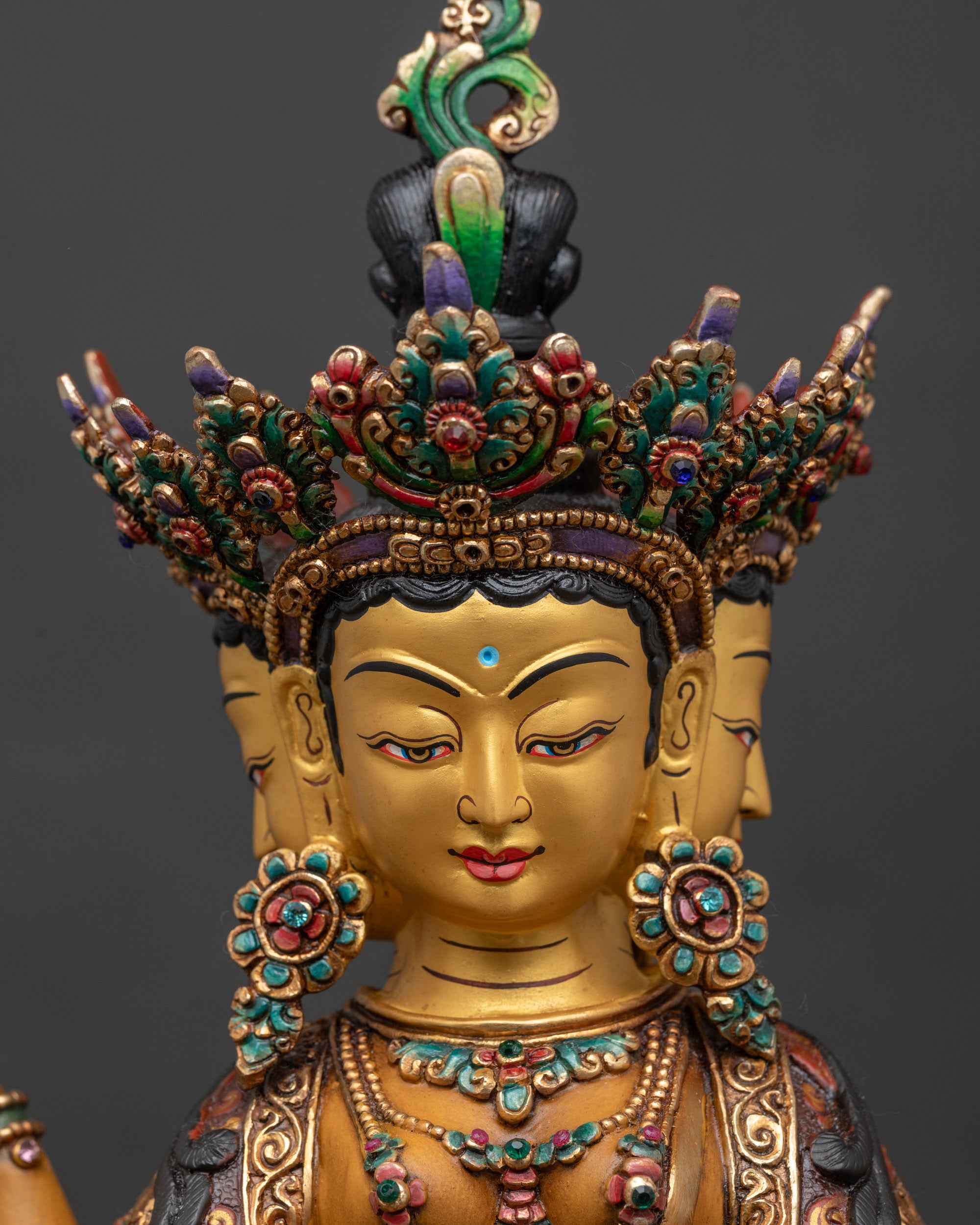 vasudhara-statue-close-up-three-serene-heads-gold-painted-face-handcrafted-nepal