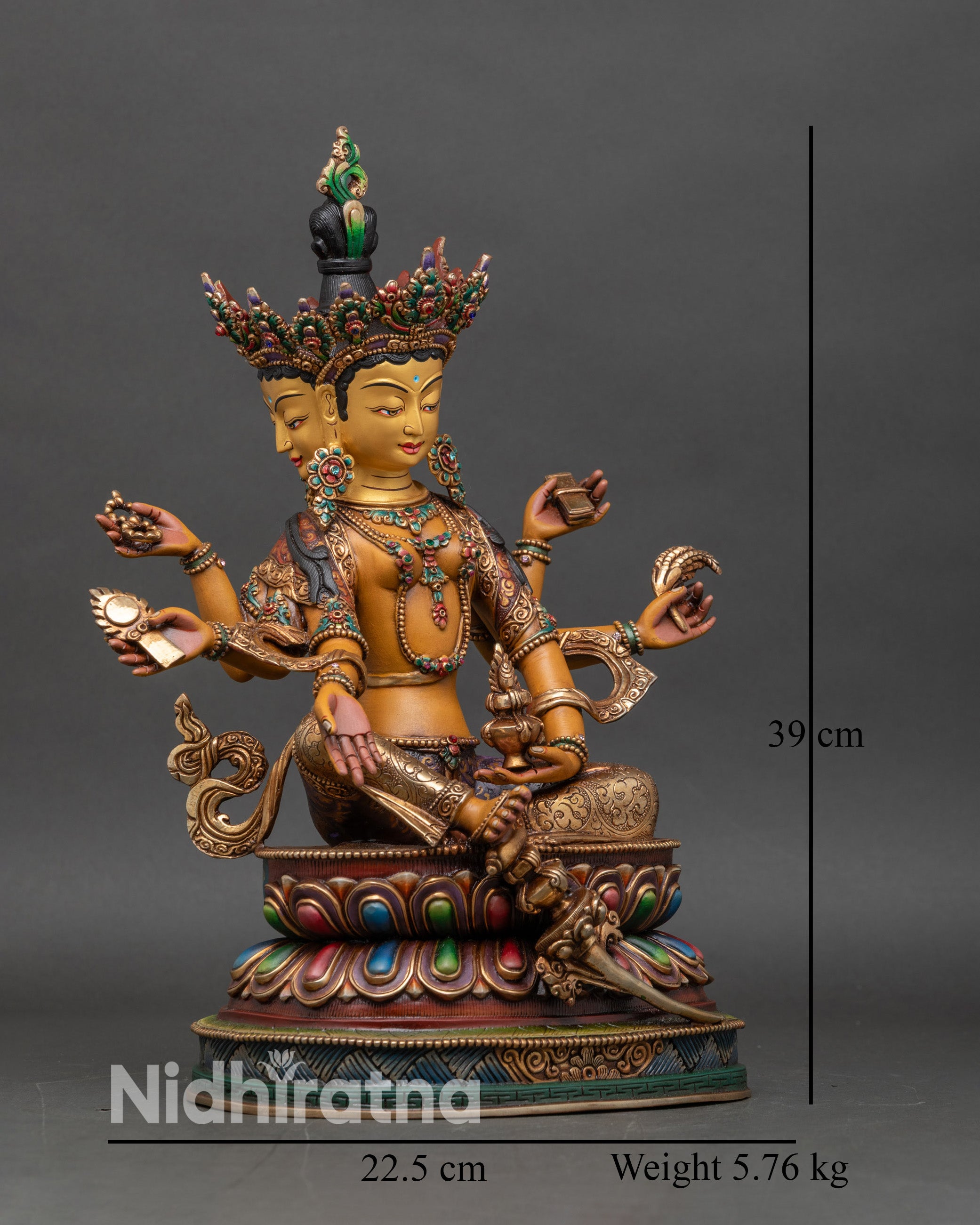 vasudhara-statue-side-view-six-arms-holding-sacred-symbols-rosary-book-grain