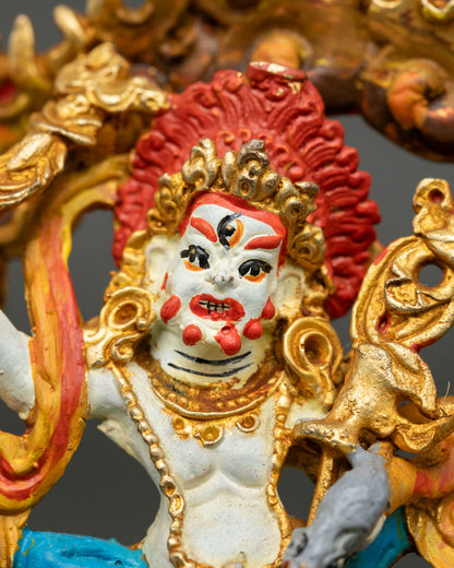 White Dzambhala Statue showing intricate gold gilded ornaments traditional details and Himalayan craftsmanship.