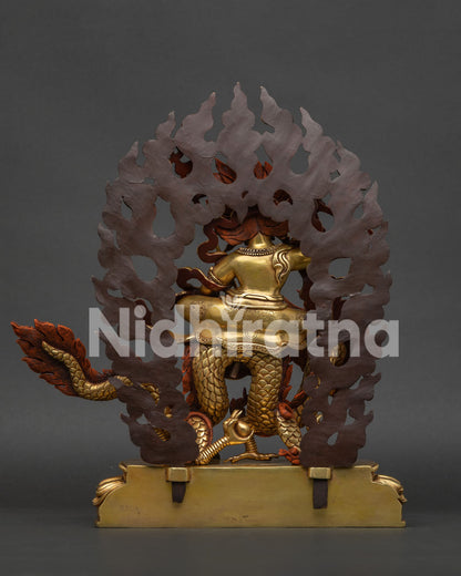 White Dzambhala statue with radiant patterned halo and Himalayan Buddhist artistry