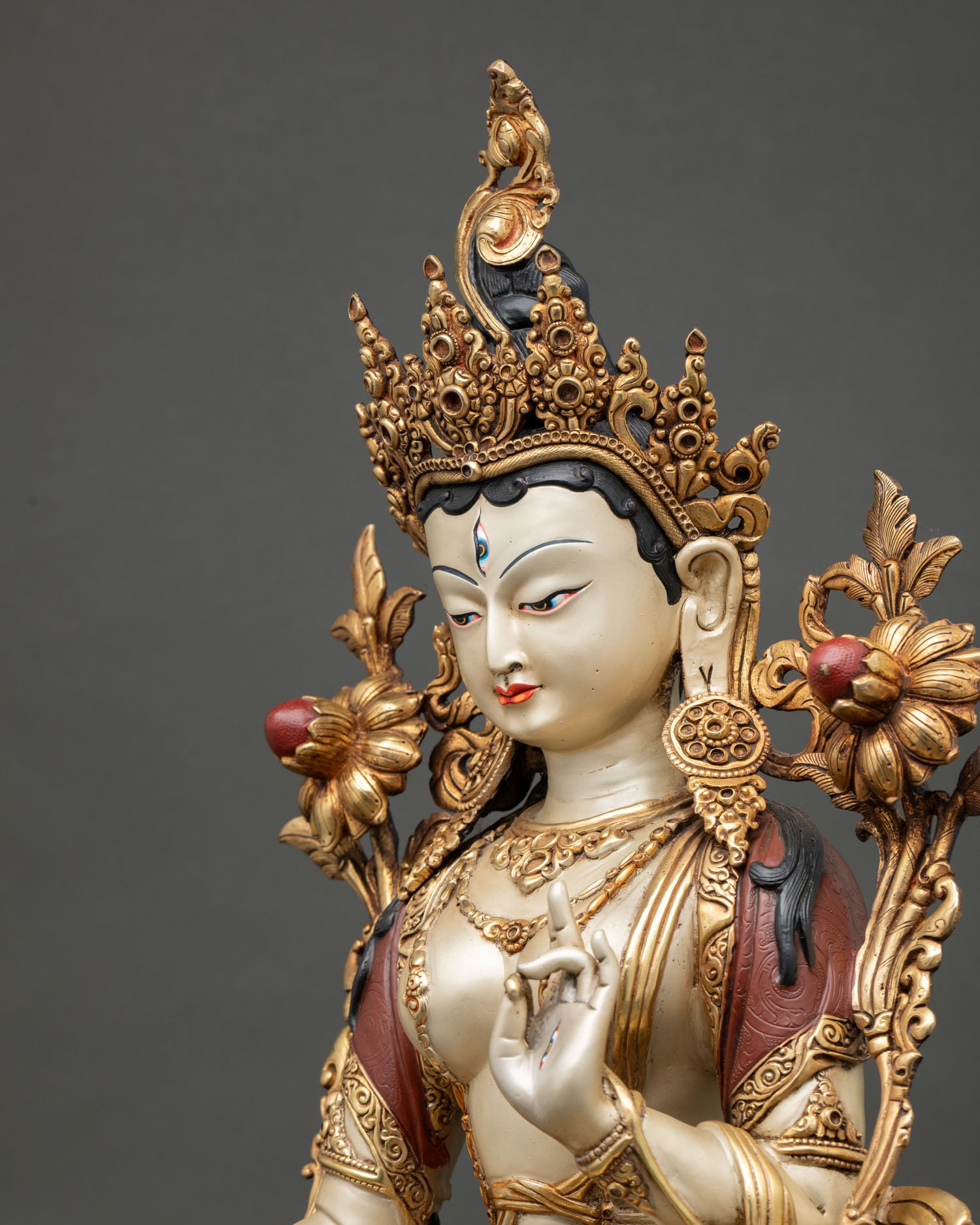 White Tara Buddhist statue highlighting sacred jewelry, serene expression, and fine handcrafted details.