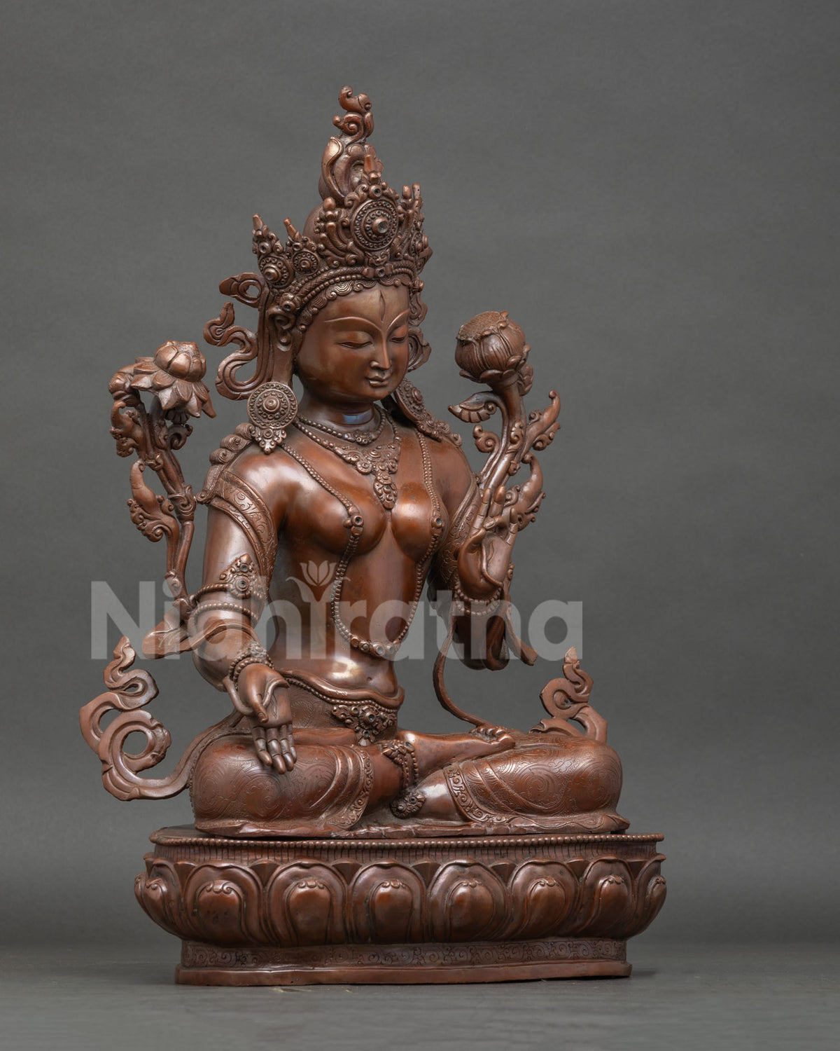 White Tara buddhist statue seated on hand carved lotus pedestal with seven all seeing eyes.
