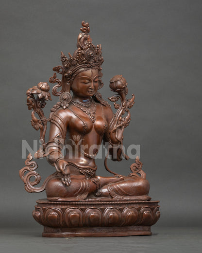 White Tara buddhist statue seated on hand carved lotus pedestal with seven all seeing eyes.