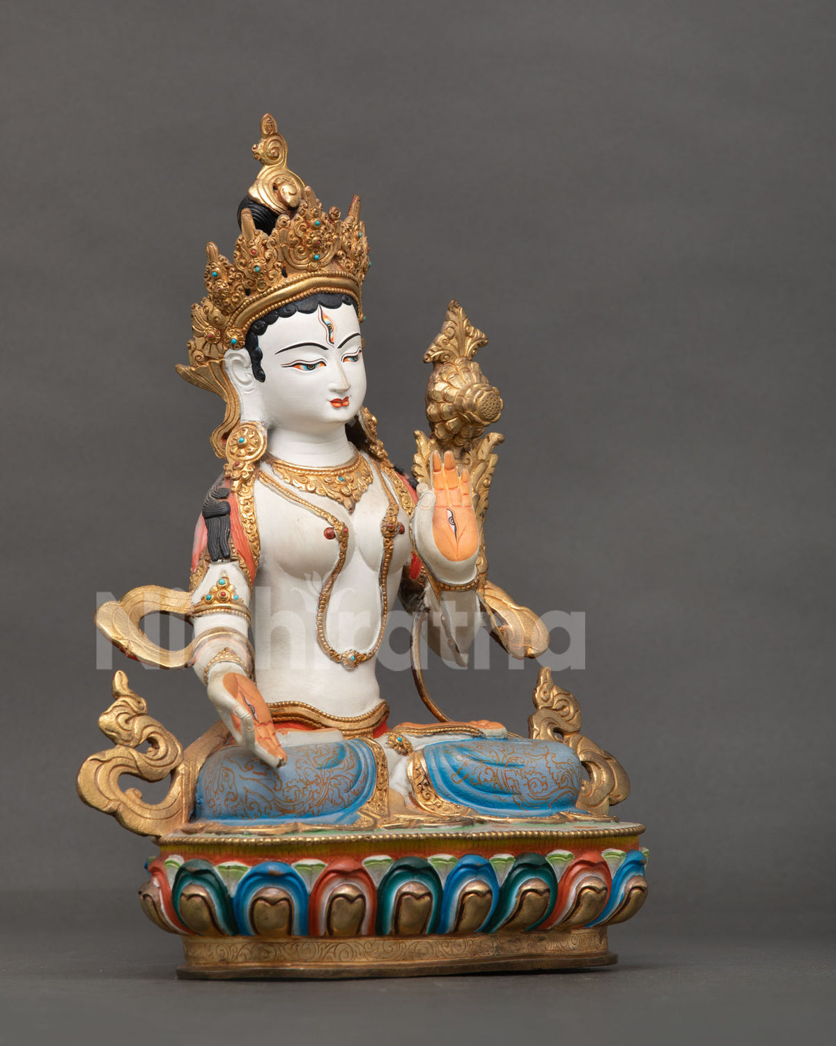 White Tara Buddhist statue featuring seven compassionate eyes on her face palms and soles.