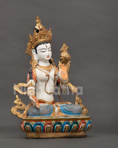 White Tara Buddhist statue featuring seven compassionate eyes on her face palms and soles.