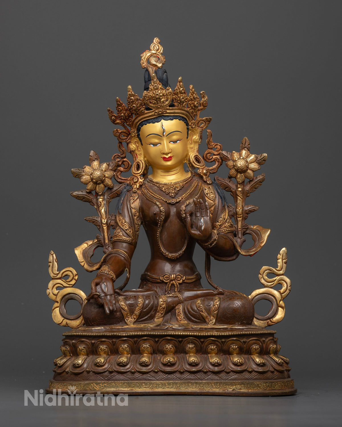 White Tara Buddhist statue with seven eyes seated on a hand carved double lotus pedestal made by a Newari artist in Nepal.