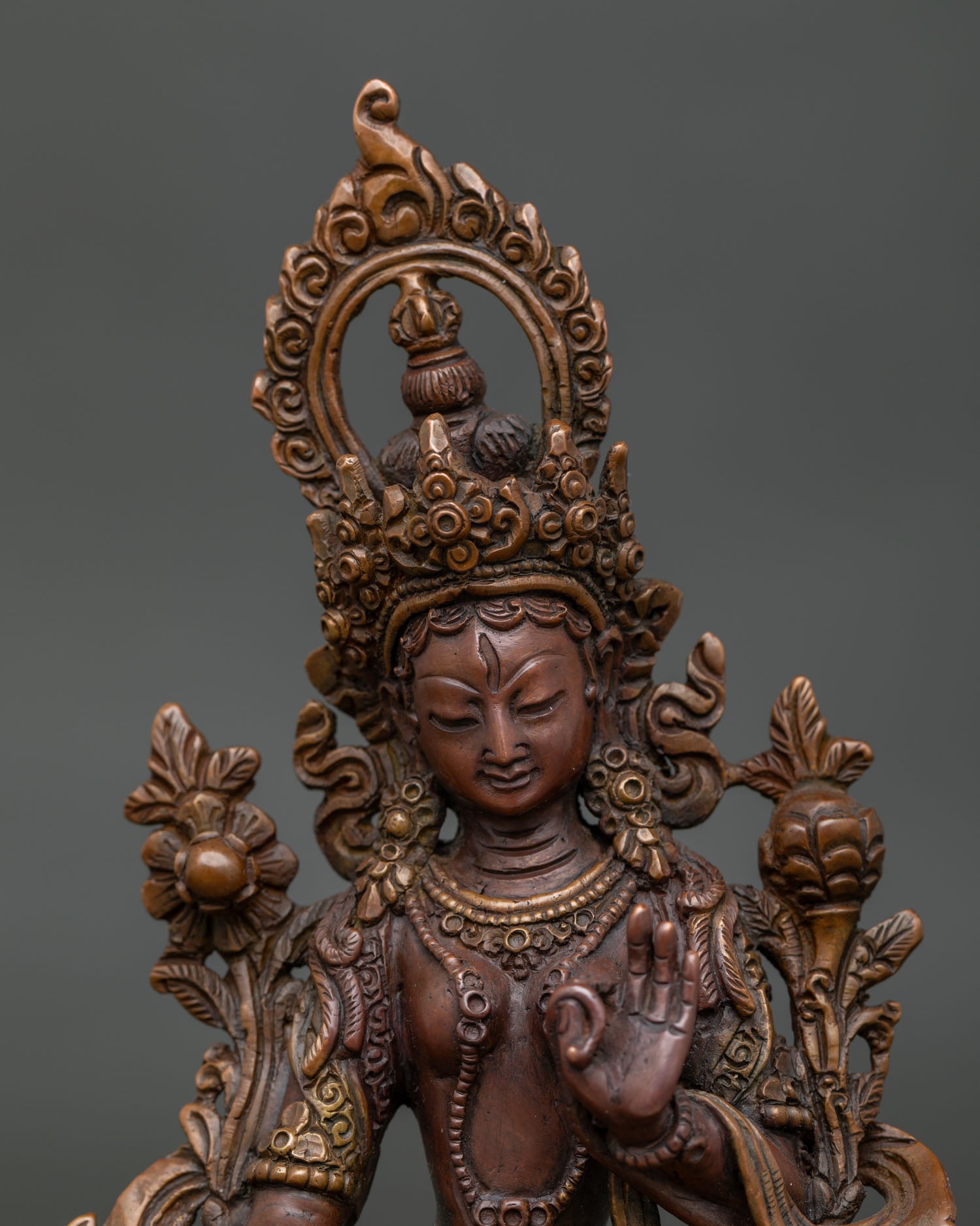 White Tara copper statue with Five-Wisdom diadem and flaming aureole.