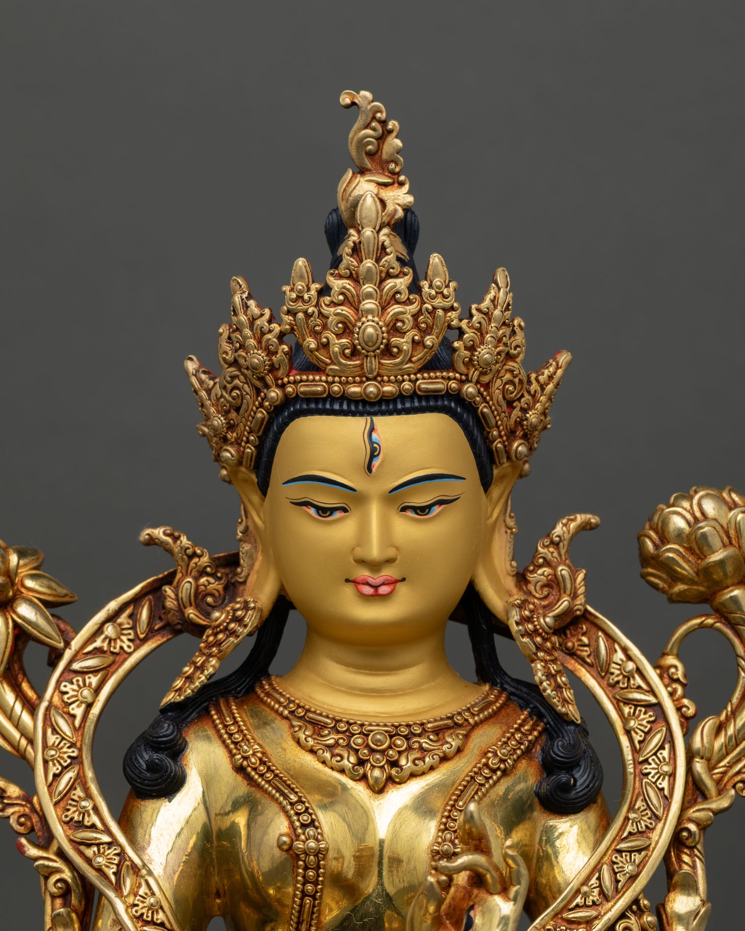 White Tara face close up serene gold painted, compassion goddess, Himalayan craftsmanship