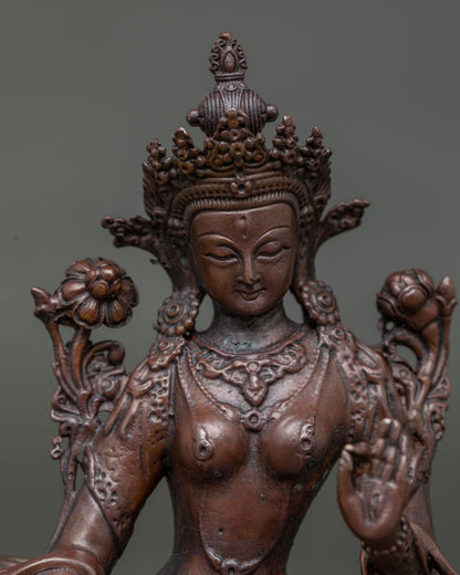 White tara face showing serene expression and intricate buddhist craftsmanship.