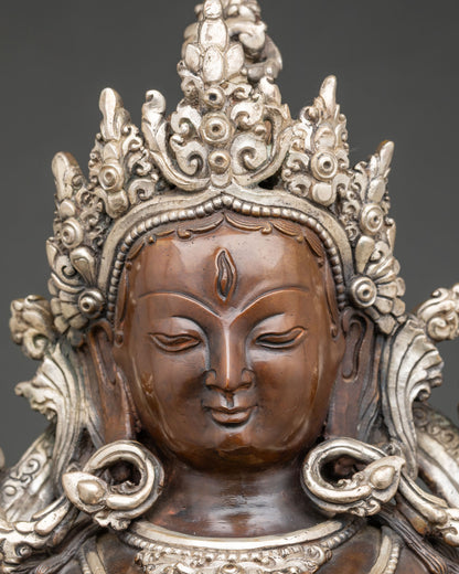 White Tara face statue showing seven compassionate eyes and five-jeweled crown