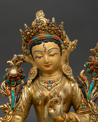White Tara seven eyes detail close up gold gilded face Nepal Kathmandu Valley lost wax handcrafted healing goddess statue