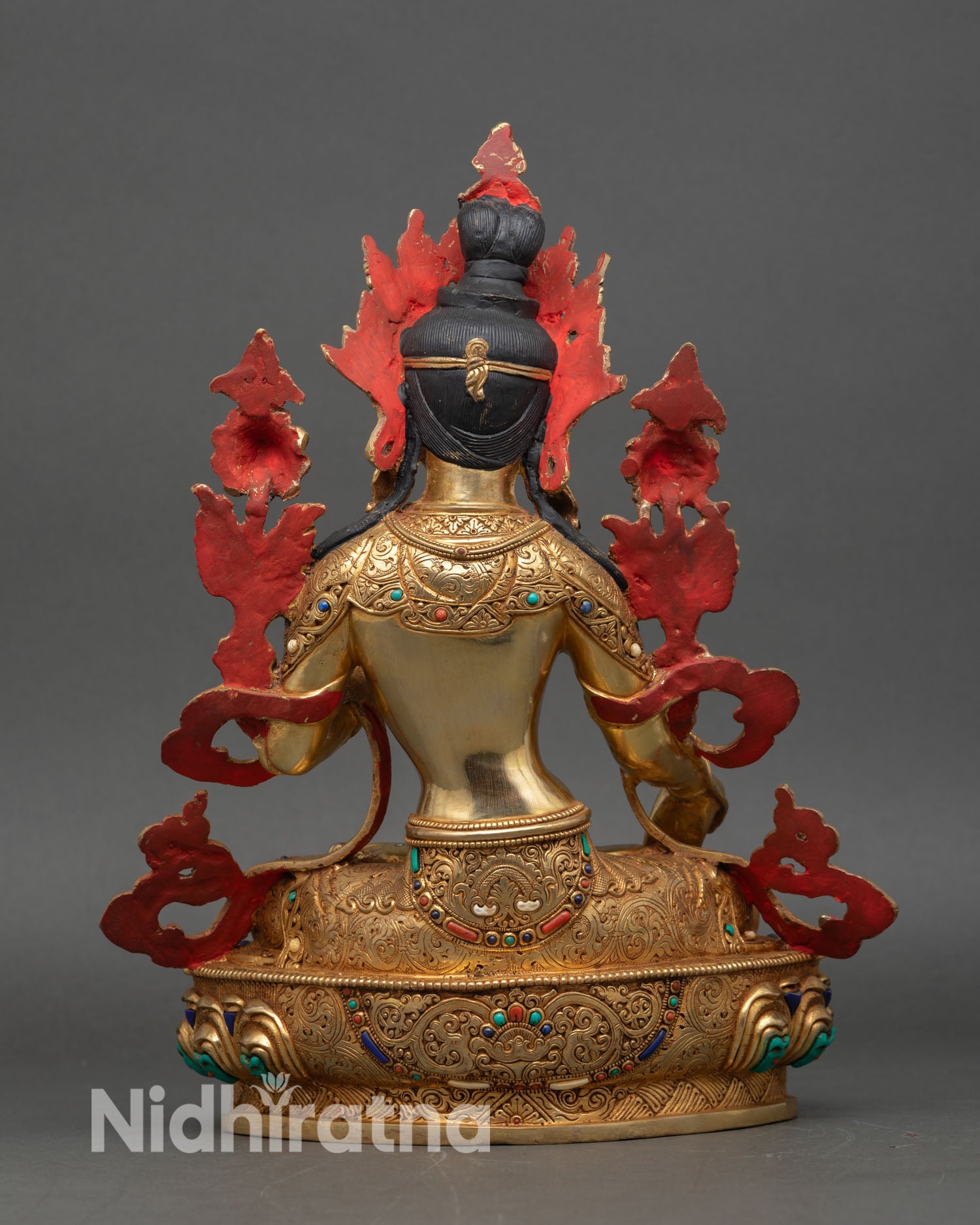white tara statue back view, detailed lotus throne and gold fire-gilded copper craftsmanship