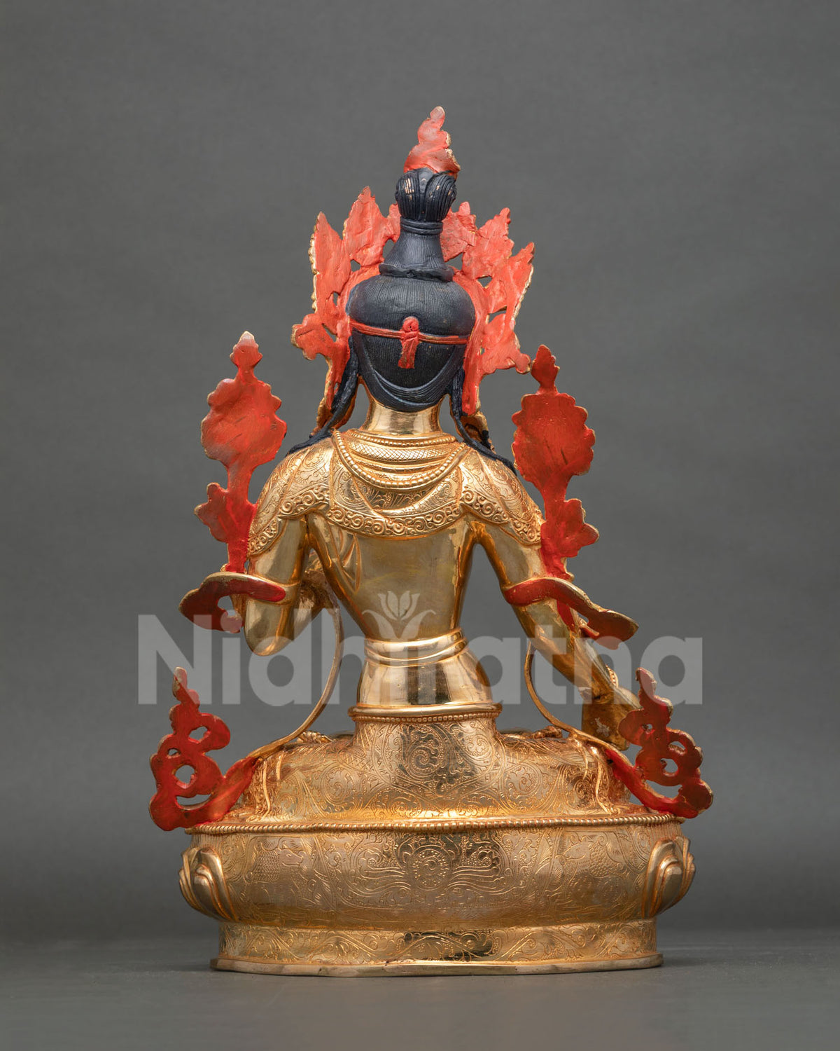 White Tara Statue back view intricate carvings gold fire gilded finish.