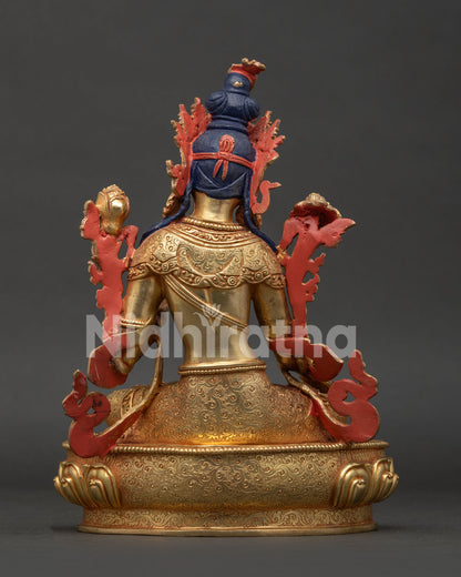 White Tara statue back view showing hand carved silk garment and Newari craftsmanship