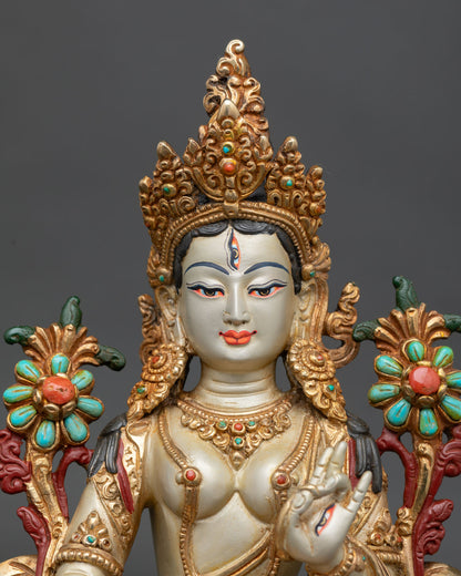 white tara statue close up handcrafted buddhist deity copper gold detailing lotus throne spiritual art nepal