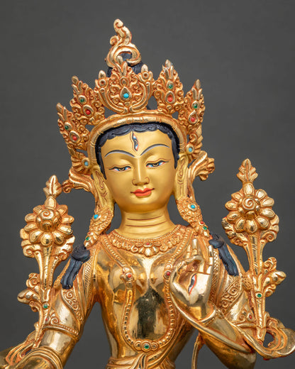 White Tara Statue face close up 24K gold painted face forehead eye.
