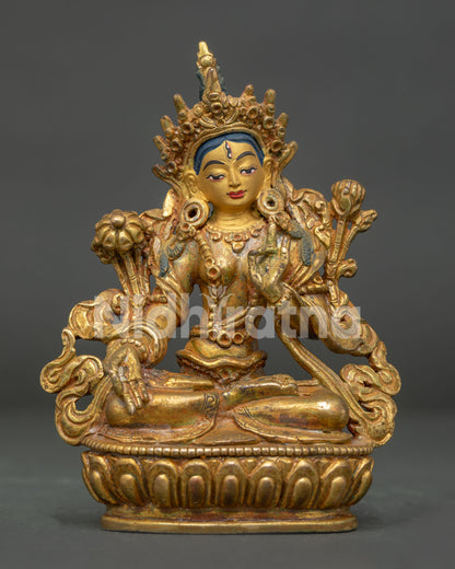 White Tara statue front view antique gold fire gilded copper from Nepal.