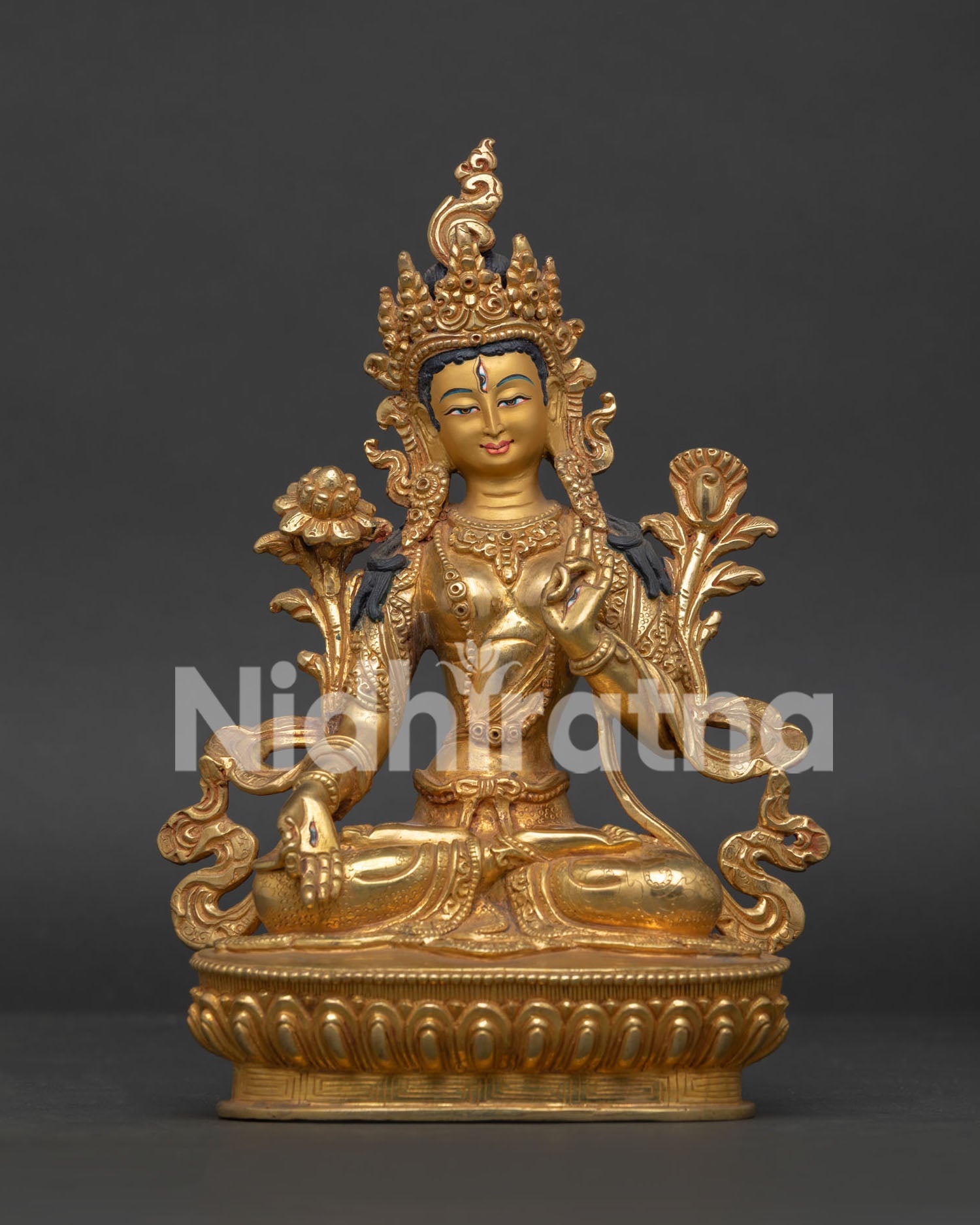 White Tara statue handmade in Nepal with gold fire gilded copper body.