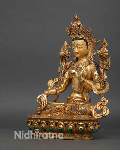 white tara statue left side view, intricate lotus throne and dhoti folds with semi-precious stones
