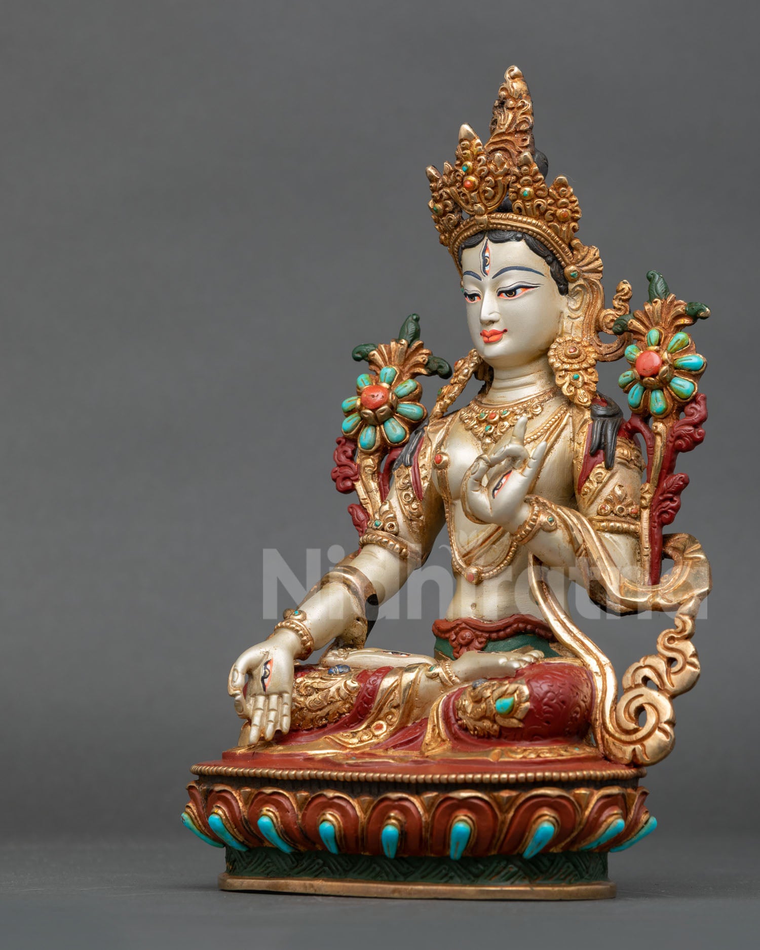 white tara statue left side view nepalese buddhist sculpture gold accents lotus pedestal compassion deity figurine