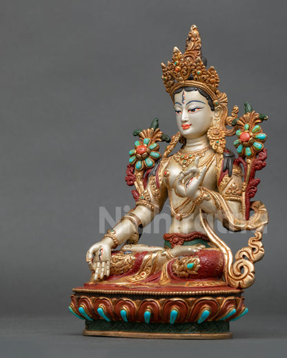 white tara statue left side view nepalese buddhist sculpture gold accents lotus pedestal compassion deity figurine